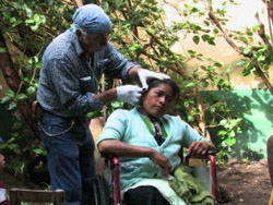 Don Sergio Castro attending a patient.
